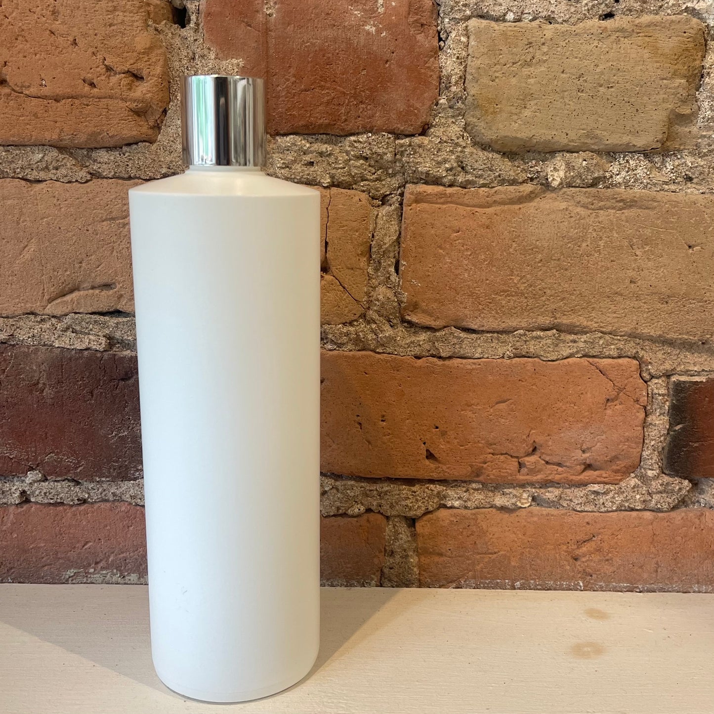 Bouteille en plastique avec bec verseur