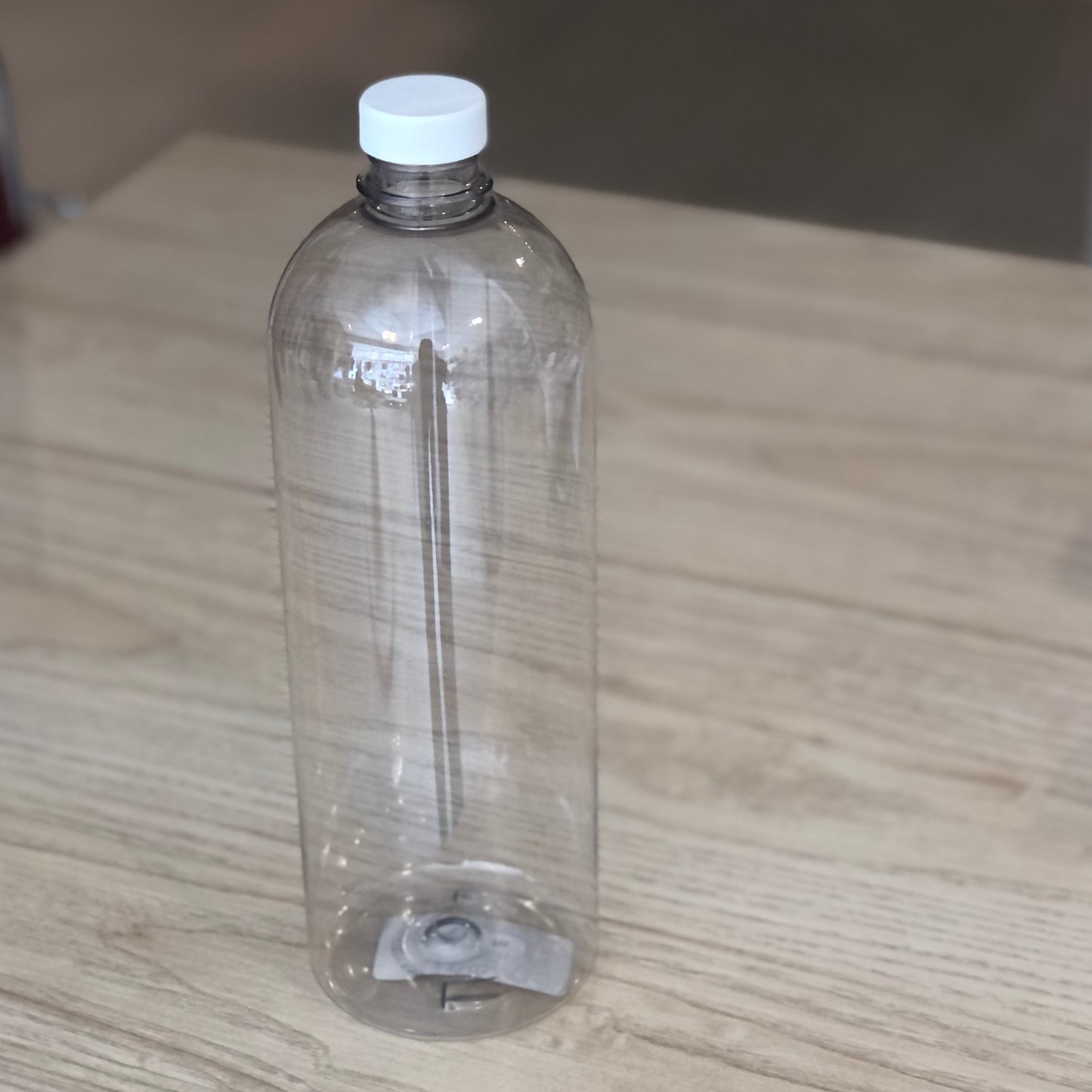 Bouteille en plastique avec bouchon plat